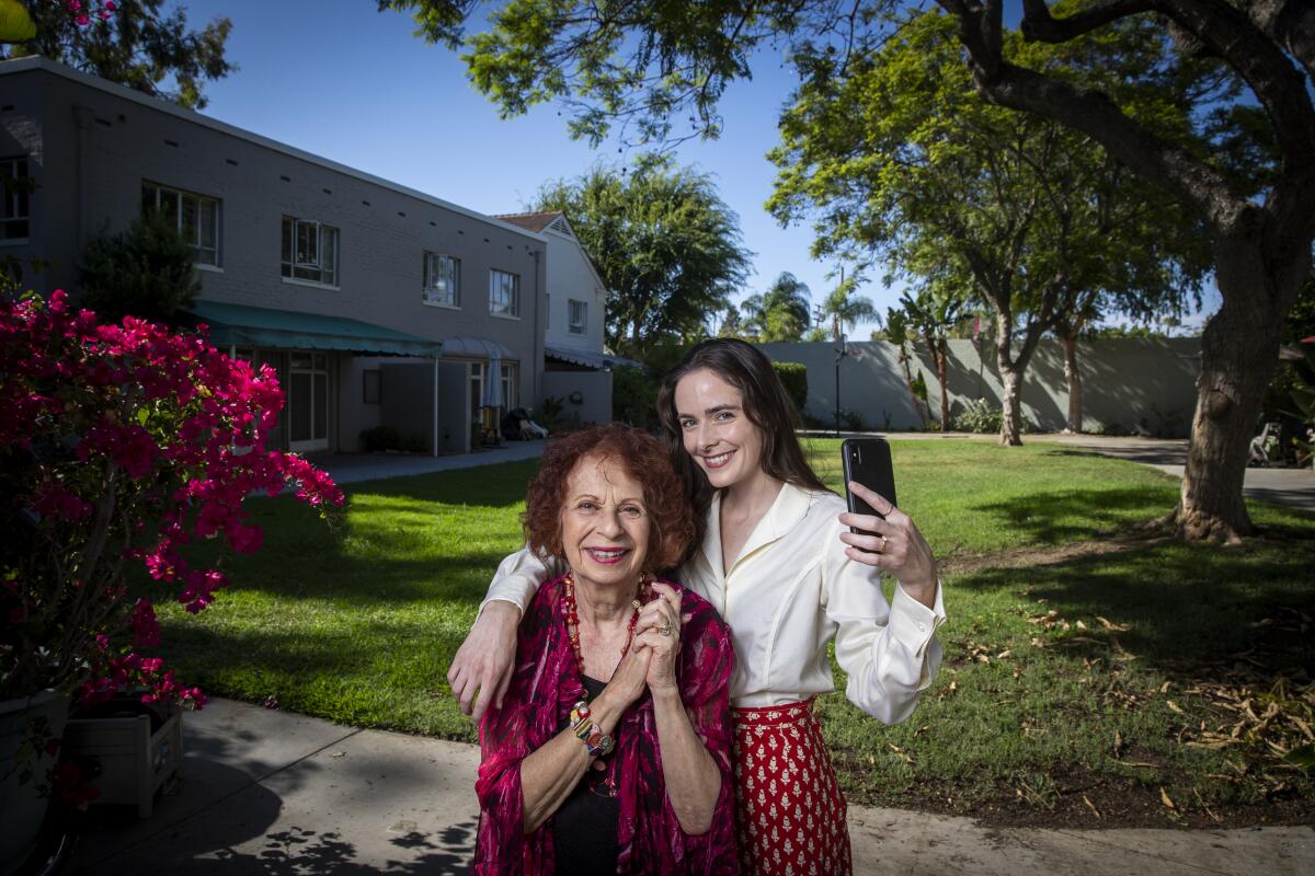 Actress Annie Korzen, left, and her friend Mackenzie Morrison pose for a portrait at Korzen’s Los Angeles home July 29.