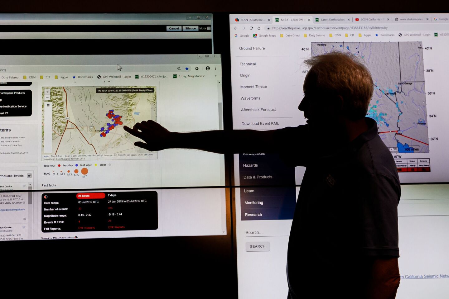 U.S. Geological Survey seismologist Robert Graves points to a map showing where two fault lines caused the earthquake during a news conference at Caltech in Pasadena.