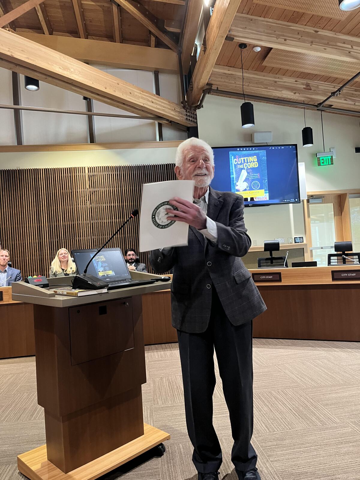 Marty Cooper with the proclamation presented to him at the Del Mar City Council meeting May 15.