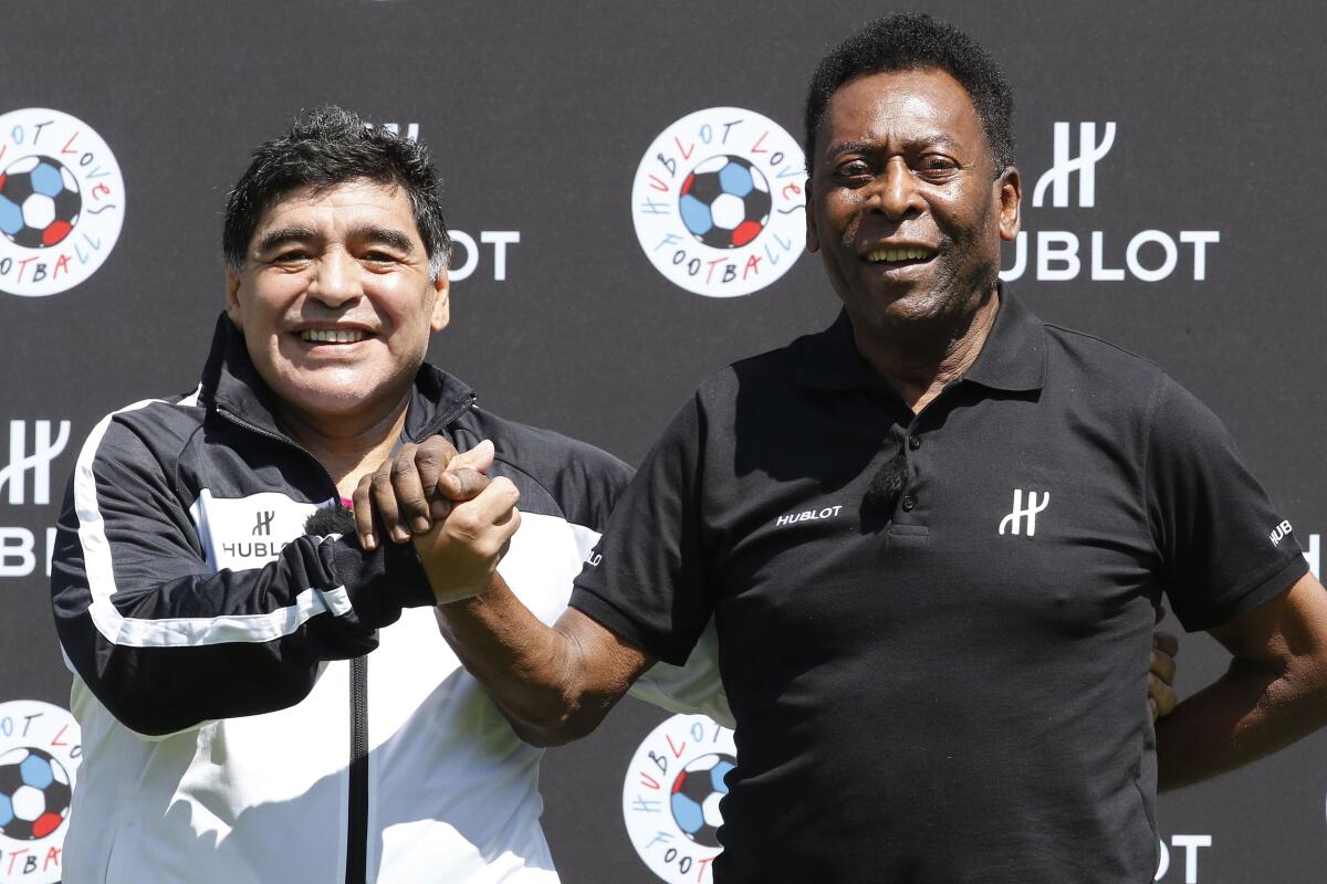 Diego Maradona, left, and 笔别濒é attend an event in Paris ahead of the 2016 European soccer championship.