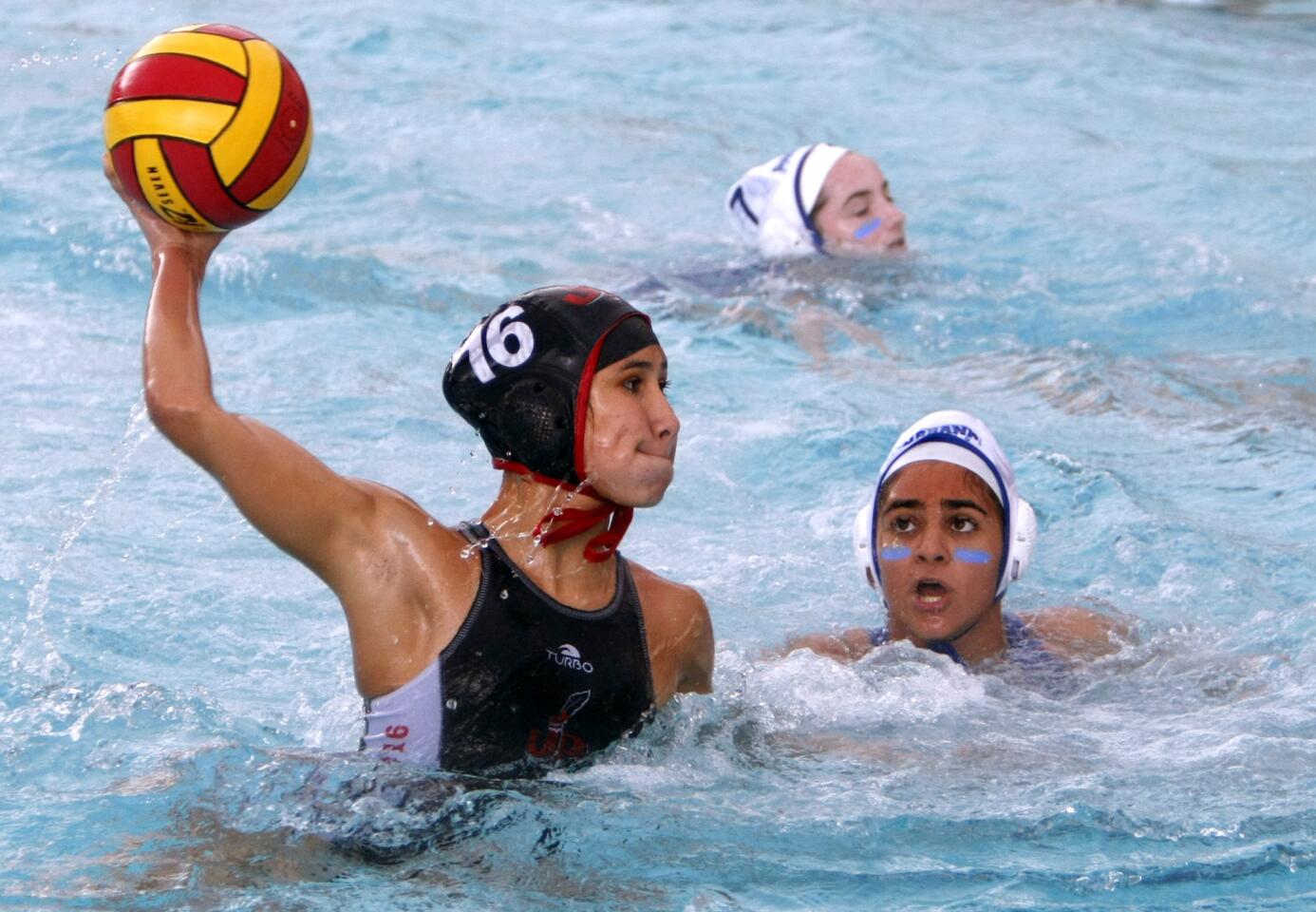 Burroughs High School girls water polo player #16 Aleah Orozco takes a shot on goal in home game vs. Burbank High School, in Burbank on Thursday, Jan. 12, 2017. Burroughs won the game 13-3.