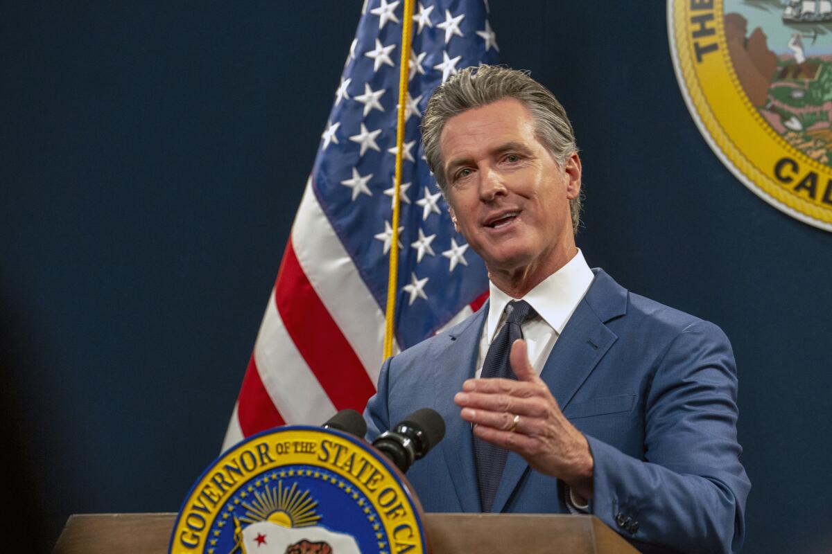 California Gov. Gavin Newsom speaks at a lectern