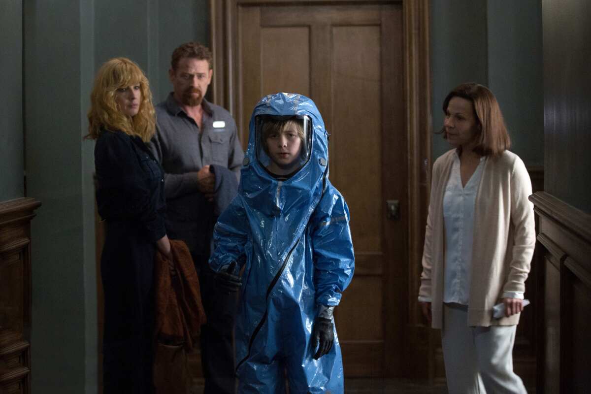 Kelly Reilly, from left, Max Martini, Charlie Shotwell (in a blue HAZMAT-style suit) and Lili Taylor in "Eli."