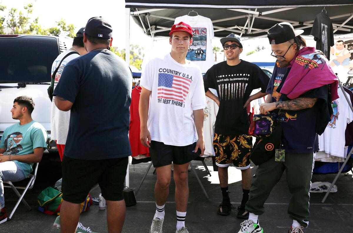 Collectors of vintage streetwear including Ethan Howell, center, and Dave Tu, right, hang out at the flea market. "It’s one of the best communities I’ve been a part of,” said one regular.