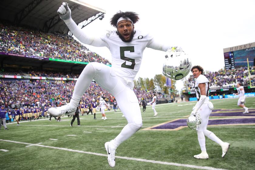 SEATTLE, WASHINGTON - OCTOBER 19: Kayvon Thibodeaux #5 of the Oregon Ducks celebrates after defeating the Washington Huskies 35-31 during their game at Husky Stadium on October 19, 2019 in Seattle, Washington. (Photo by Abbie Parr/Getty Images)