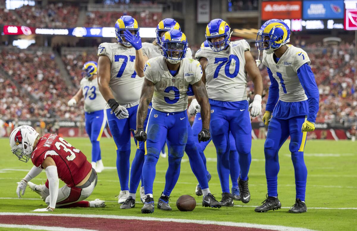Running back (3) Cam Akers of the Los Angeles Rams celebrates with teammates after scoring a touchdown