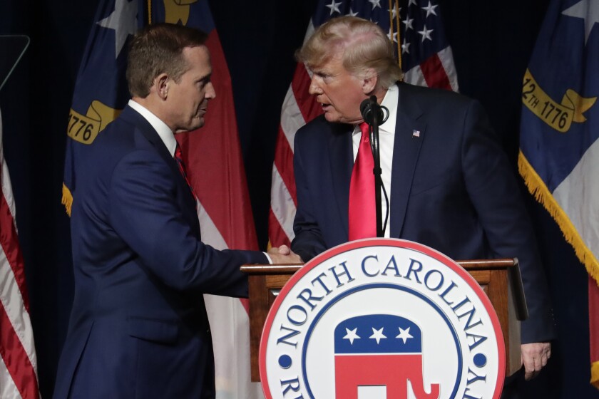 Former President Donald Trump, right, announces his endorsement of N.C. Rep. Ted Budd 