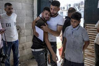 Palestinians mourn their 4-day-old twin relatives, killed in the Israeli bombardment of the Gaza Strip, as he holds their birth certificates, at a hospital morgue in Deir al-Balah, Tuesday, Aug. 13, 2024. (AP Photo/Abdel Kareem Hana)