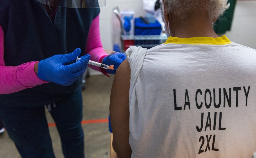 An L.A. County jail inmate receives a shot.