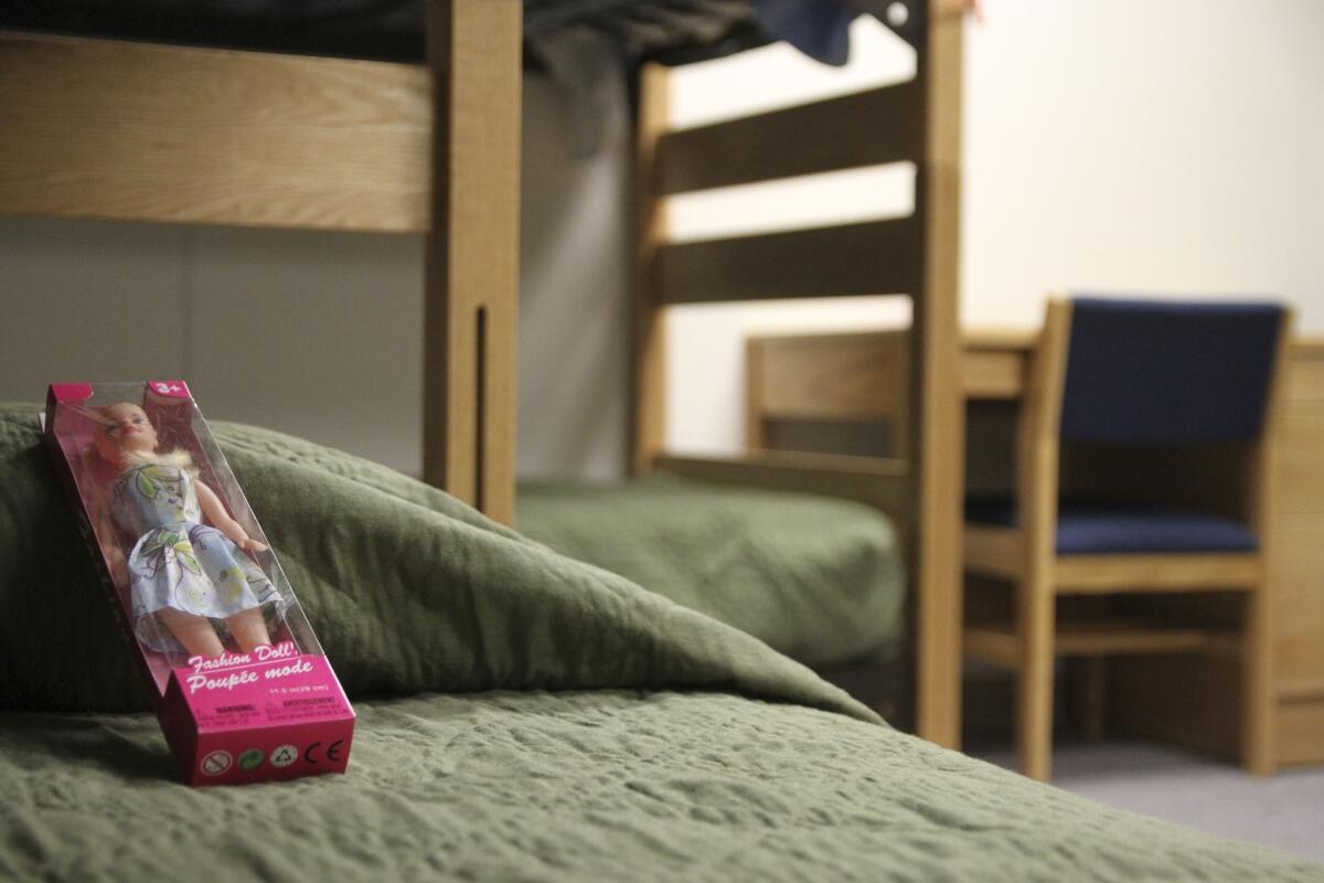 A doll rests on a bed at an immigration detention center in Artesia, N.M.