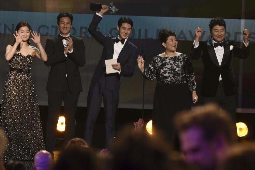 Park So-dam, from left, Lee Sun Gyun, Choi Woo-shik, Lee Jeong-eun and Kang-Ho Song accept the award for outstanding performance by a cast in a motion picture for "Parasite" at the 26th annual Screen Actors Guild Awards at the Shrine Auditorium & Expo Hall on Sunday, Jan. 19, 2020, in Los Angeles. (AP Photo/Chris Pizzello)