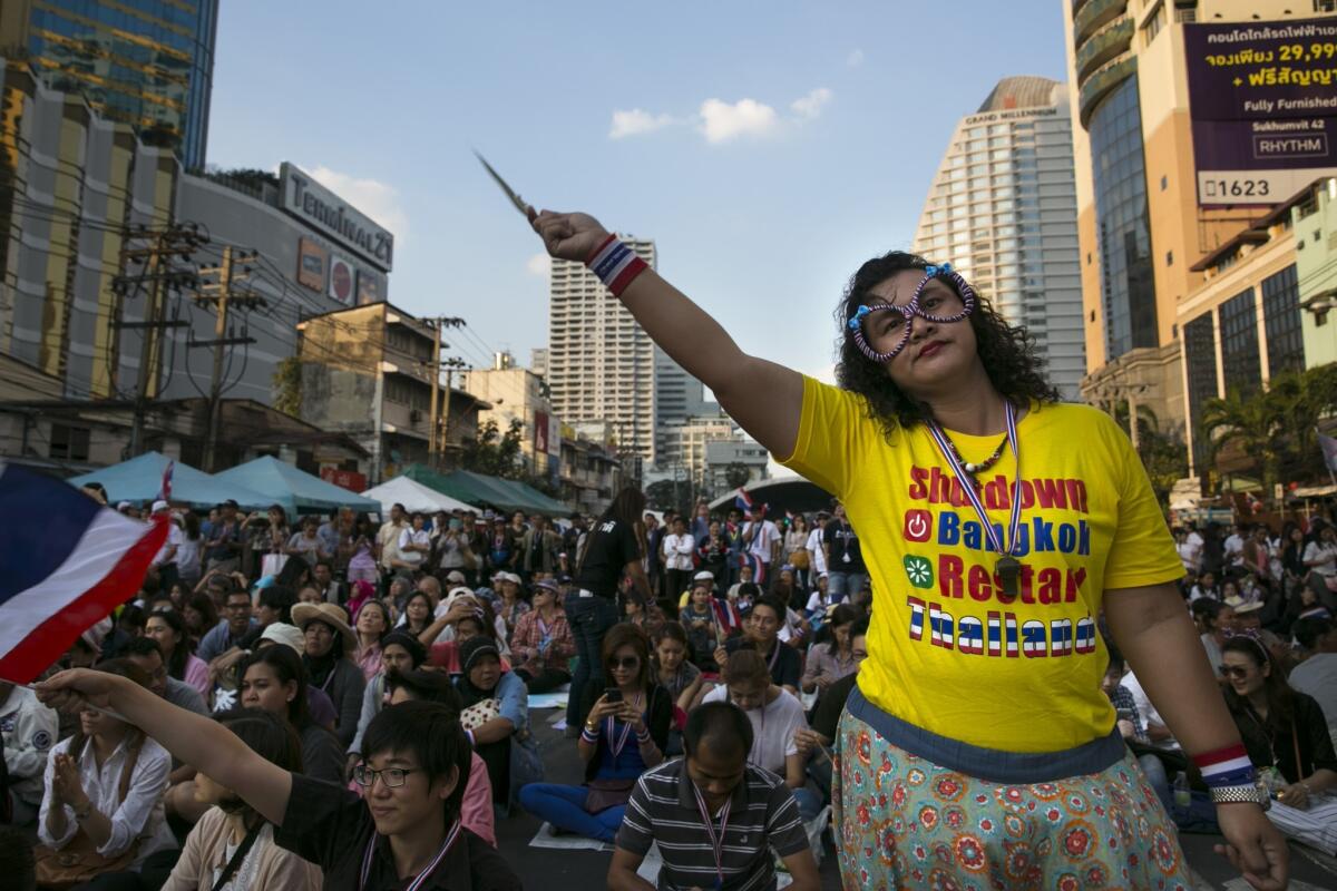 Anti-government protesters occupy a major intersection in downtown Bangkok on Tuesday, the second day of their "Bangkok Shutdown" demonstration.