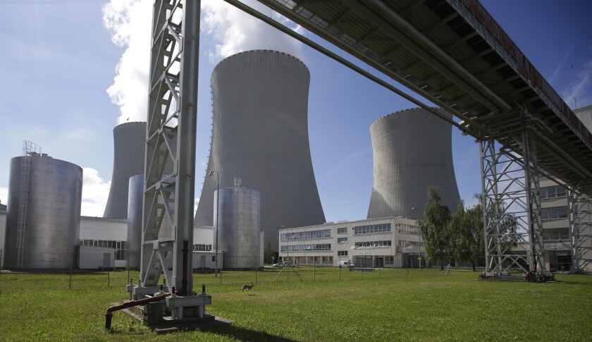 FILE - Smoke rises from cooling towers of the nuclear power plant Temelin near the town of Tyn nad Vltavou, Czech Republic, June 25, 2015. The Czech state-controlled power company CEZ said on Tuesday, June 28, 2022, Pennsylvania-based Westinghouse and Framatome will contribute to the country’s energy security by supplying the Temelin nuclear fuel for more than 10 years, starting in 2024. (AP Photo/Petr David Josek, file)