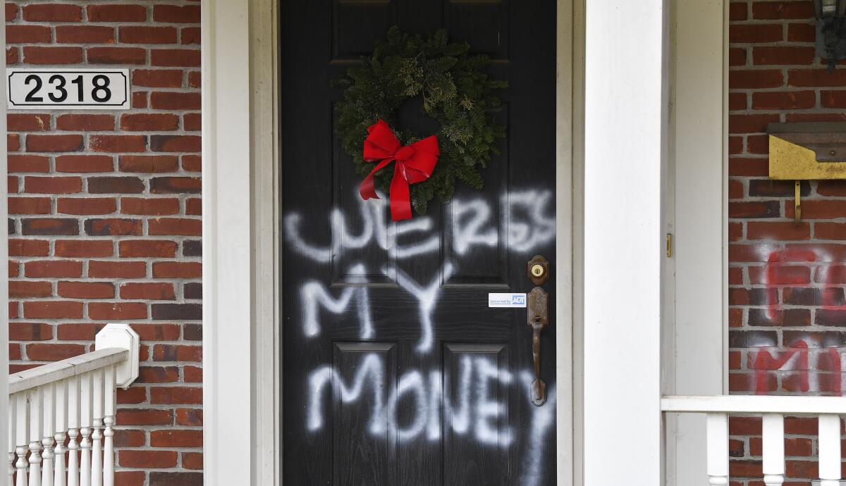 Graffiti is seen on a door of the home of Senate Majority Leader Mitch McConnell.