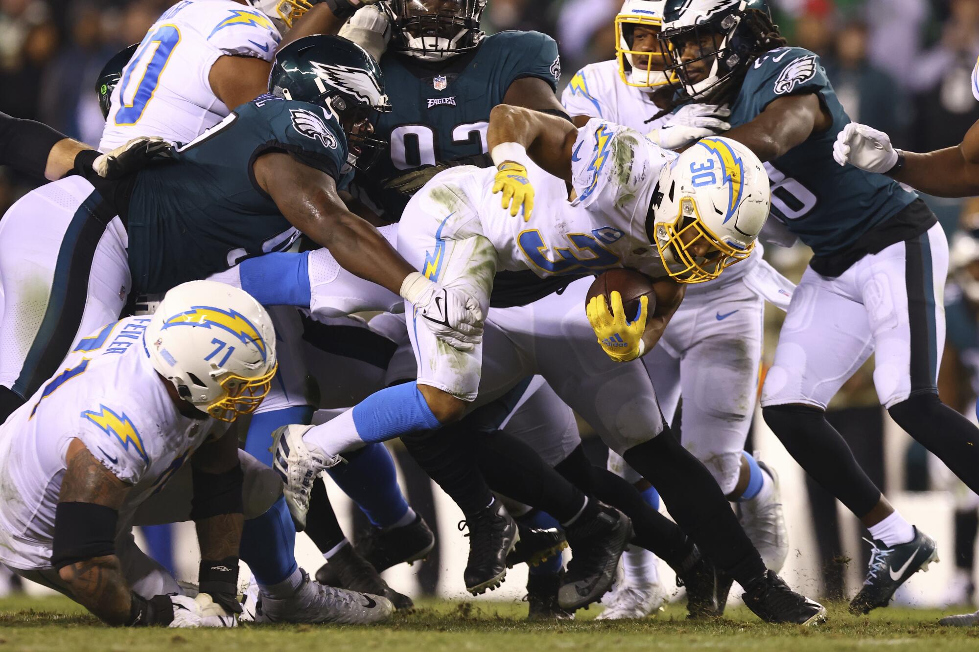 Chargers running back Austin Ekeler is tackled by Philadelphia Eagles defensive tackle Javon Hargrave.