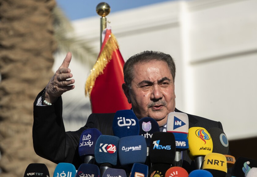 Iraqi politician Hoshyar Zebari, the Kurdistan Democratic Party (KDP) candidate for the presidency, speaks during a press conference in Baghdad, Iraq, Sunday, Feb. 13, 2022. Iraq's top court has banned Zebari from running for president amid pending corruption allegations. (AP Photo/Hadi Mizban)