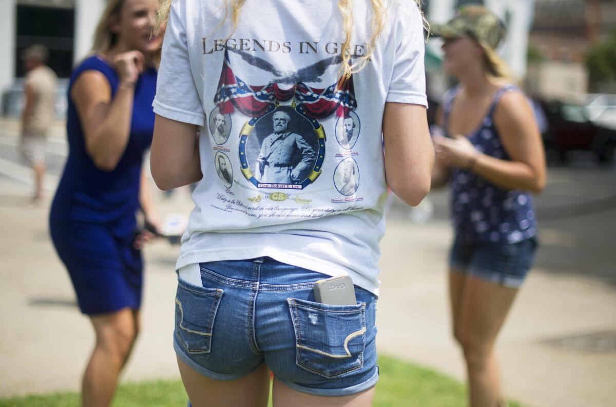 A pro-confederate flag demonstrator wears a t-shirt that depicts the Confederate legends of the US Civil War outside the South Carolina State House in Columbia, South Carolina, June 27.