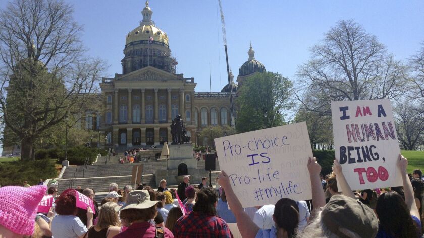 Planned Parenthood supporters rally outside the Iowa Capitol Building on May 4 in Des Moines.