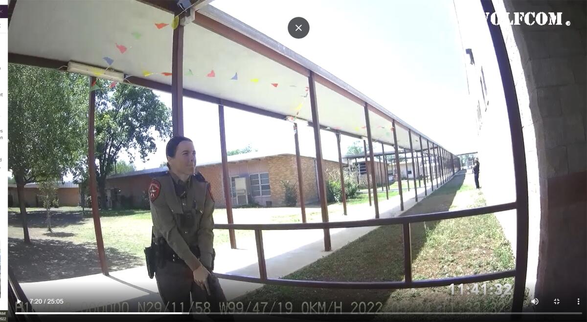 This image from video released by the City of Uvalde, Texas shows Texas Department of Public Safety trooper Crimson Elizondo responding to a shooting at Robb Elementary School, on May 24, 2022 in Uvalde, Texas. The former Texas state trooper under investigation for the law enforcement response to the deadly school shooting in Uvalde has been hired by the school district as a campus police officer. (City of Uvalde via AP)