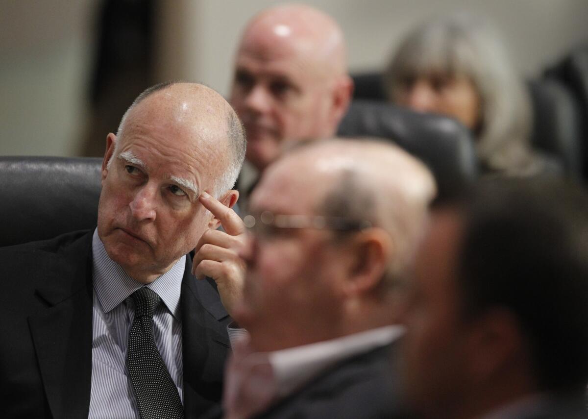 Gov. Jerry Brown, shown at a meeting in Long Beach last month, is looking to boost California's unemployment insurance program.