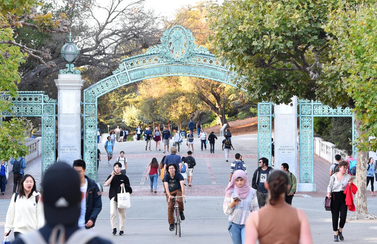 Students walk and cycle on campus at UC Berkeley