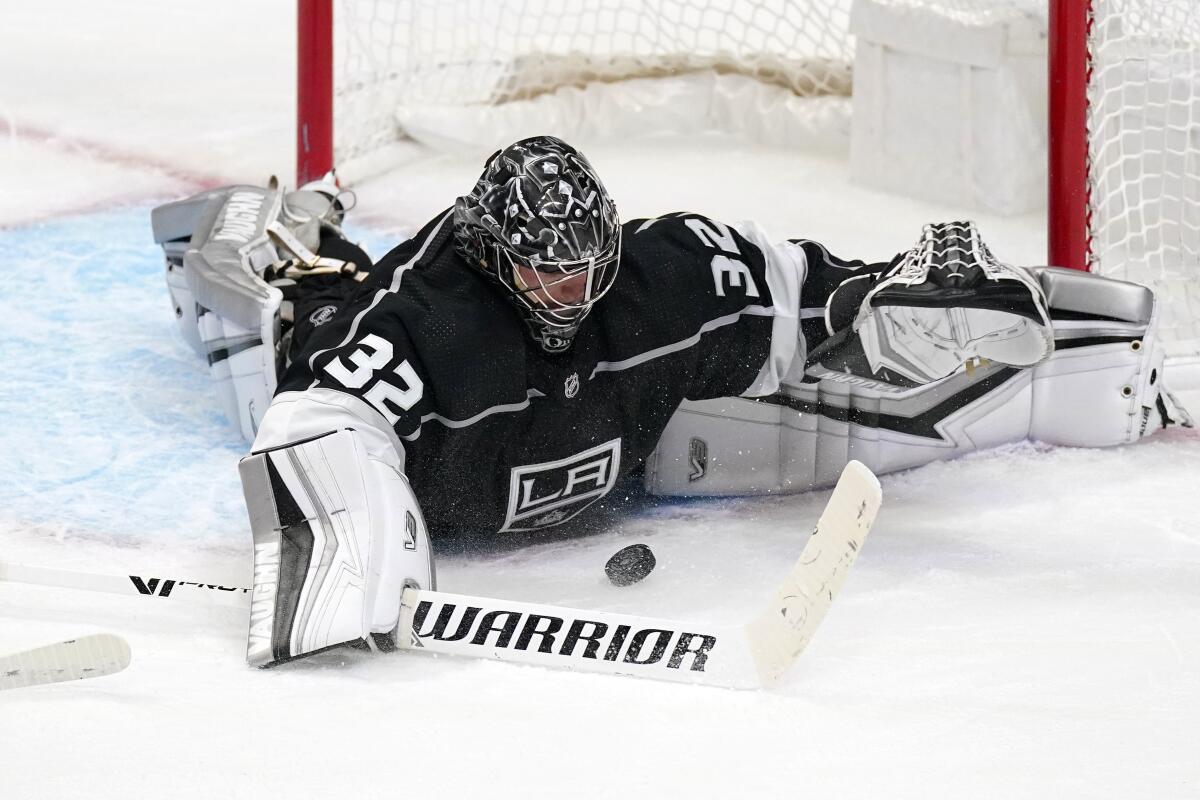 Kings goaltender Jonathan Quick stops a shot during the third period against the Minnesota Wild.