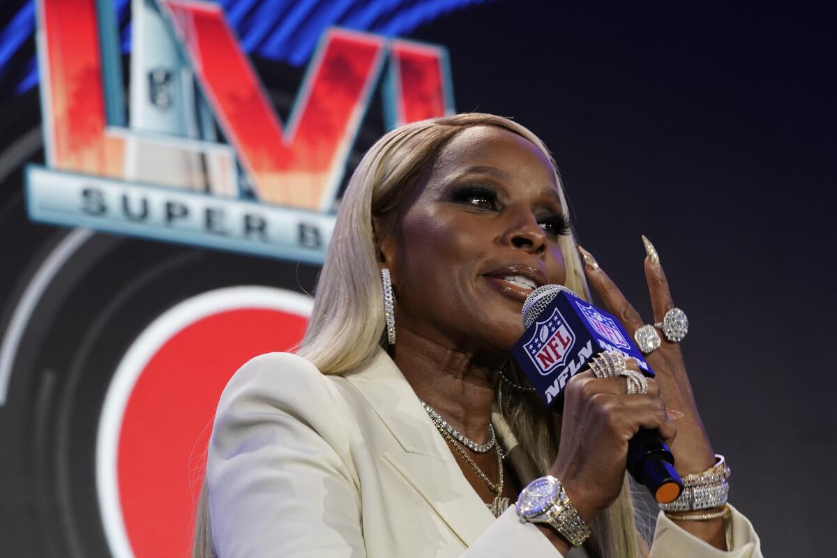 Mary J. Blige answers a question during a news conference on Thursday.