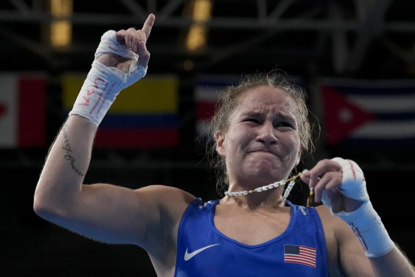 Jennifer Lozano of the United States celebrates her victory over Canada's Mckenzie Wright in a women's boxing 50kg semifinal bout at the Pan American Games in Santiago, Chile, Thursday, Oct. 26, 2023. (AP Photo/Martin Mejia)