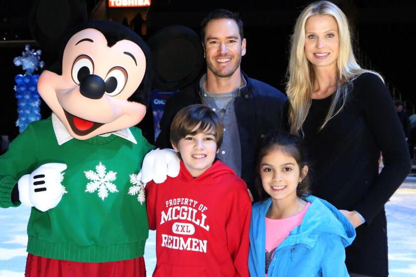 Mark-Paul Gosselaar, wife Catriona and the actor's older kids, Michael and Ava, join Mickey Mouse for a skating party Thursday at Staples Center in downtown L.A.