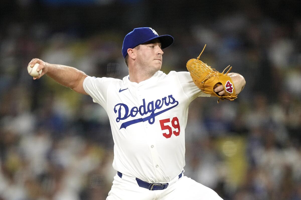 Los Angeles Dodgers relief pitcher Evan Phillips throws to the plate during the ninth inning.