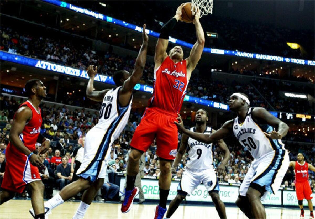 Clippers forward Blake Griffin (32) elevates to the basket against the defense of the Memphis Grizzlies.