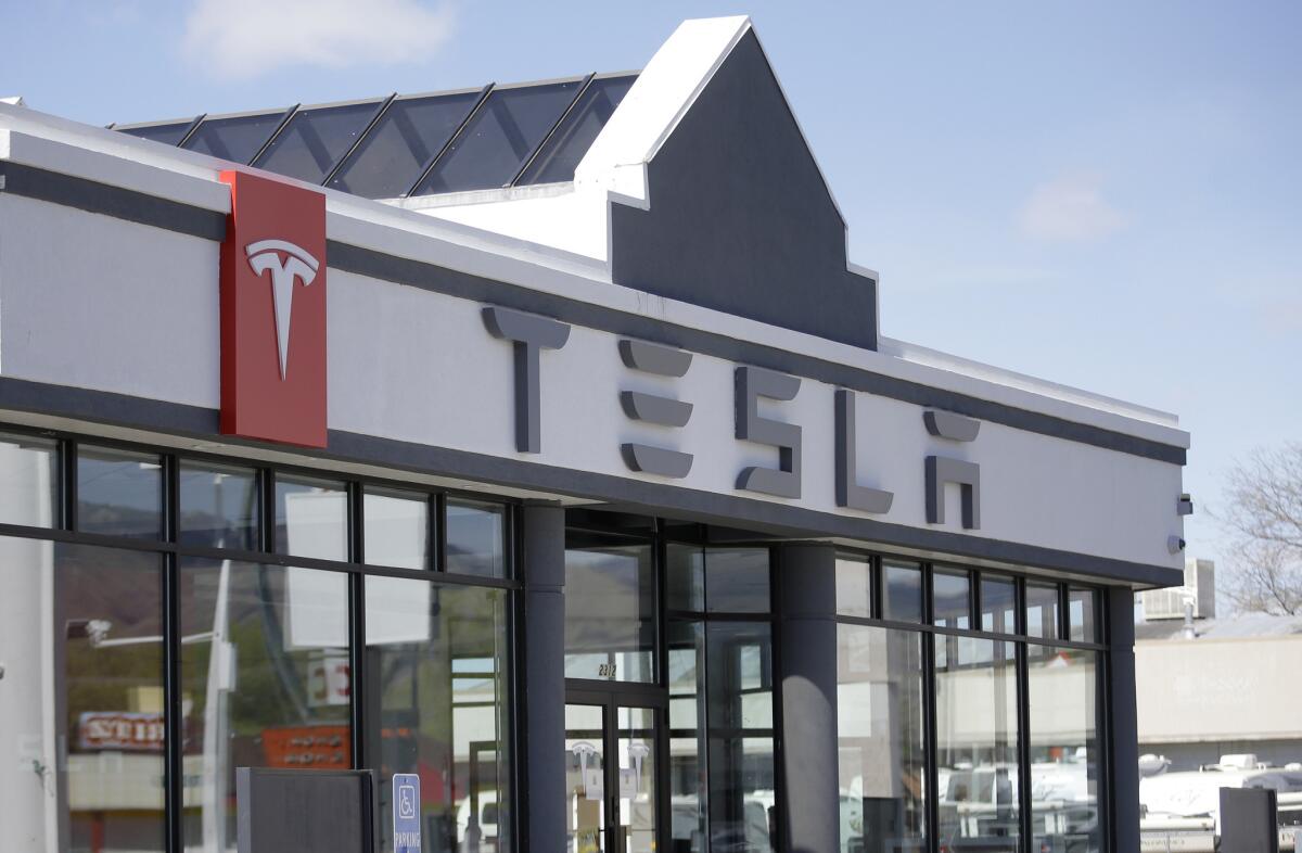 A new Tesla Motors showroom in Salt Lake City is shown. The automaker will detail plans Thursday night for selling batteries for energy storage to residential and commercial customers.