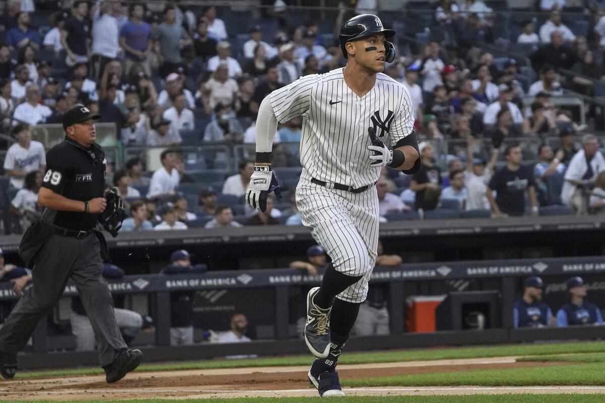New York Yankees' Aaron Judge watches his home run in the first inning of the team's baseball game against the Tampa Bay Rays, Wednesday June 15, 2022, in New York. (AP Photo/Bebeto Matthews)