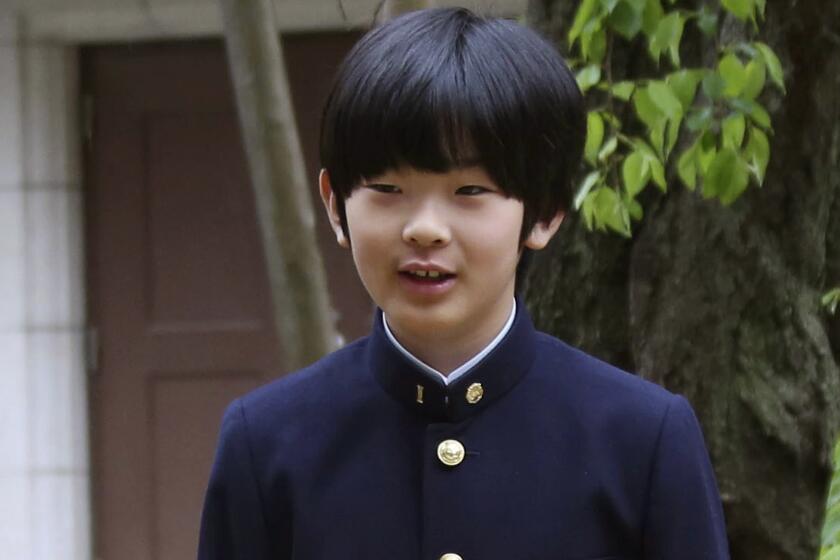 In this April 8, 2019, file photo, Prince Hisahito poses for photos at Ochanomizu University Junior High School.