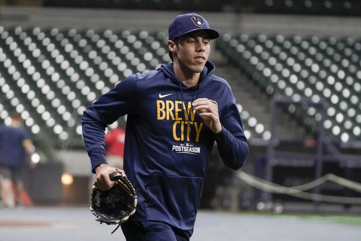 Milwaukee Brewers' Christian Yelich runs at a practice for the Game 1 of the NLDS baseball game Tuesday, Oct. 5, 2021, in Milwaukee. The Brewers plays the Atlanta Braves in Game 1 on Friday, Oct. 8, 2021. (AP Photo/Morry Gash)