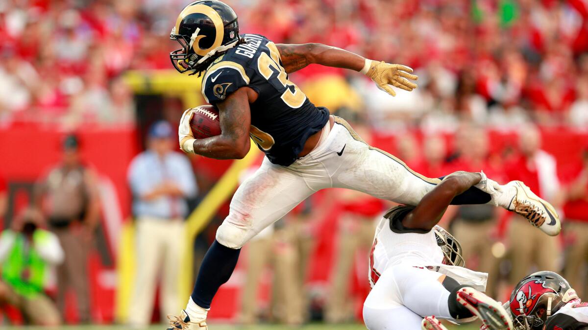Rams running back Todd Gurley hurdles a Buccaneers defender during the game on Sept. 25.