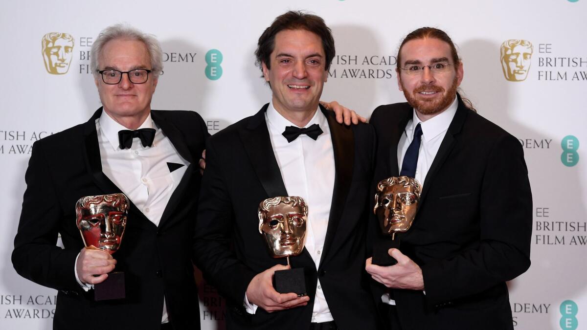 Claude La Haye, Sylvain Bellemare and Bernard Gariépy Strobl after winning the award for Best Sound for "Arrival" at the 2017 British Academy Film Awards in London earlier this month