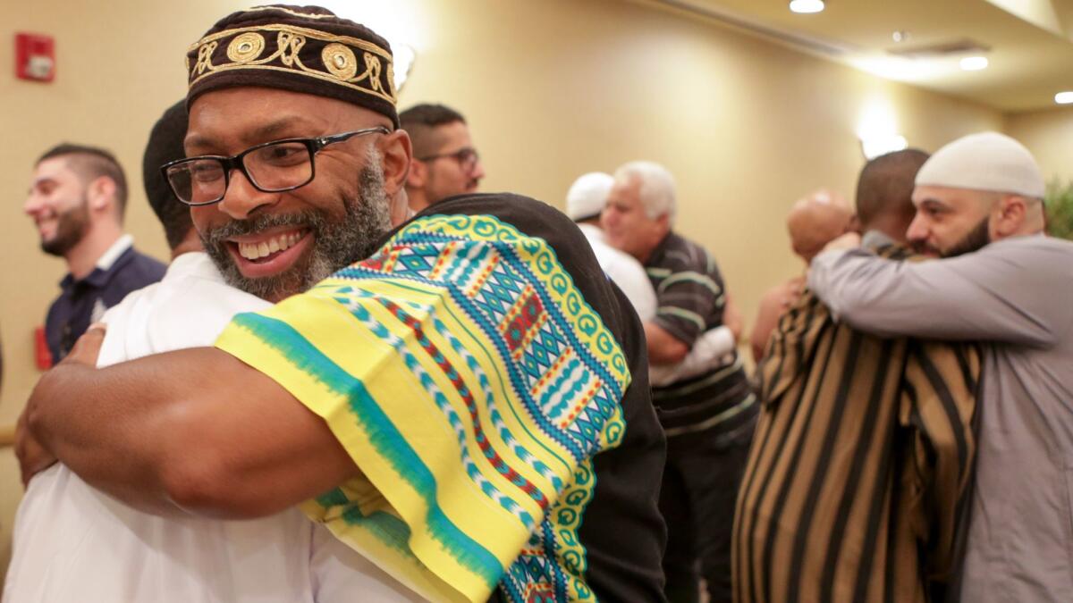 Muslims gather at Middle Ground Muslim Center to offer Eid al-Fitr prayers Sunday in Upland.