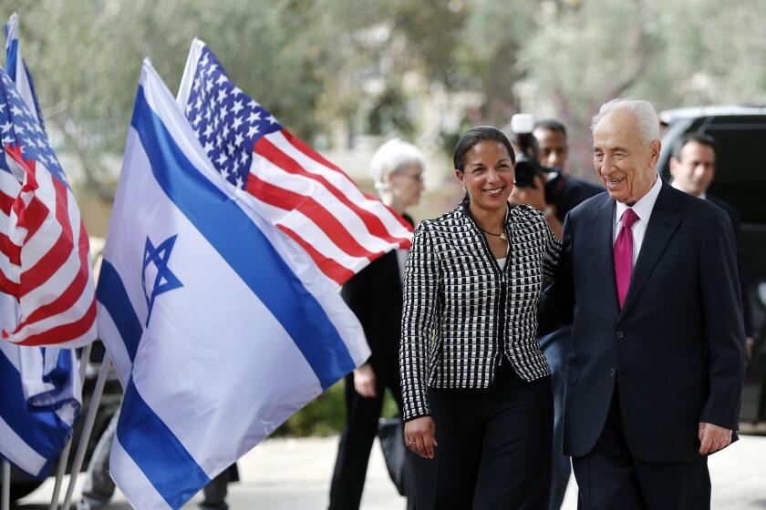 Israeli President Shimon Peres welcomes U.S. national security advisor Susan Rice before their meeting in Jerusalem on May 7.