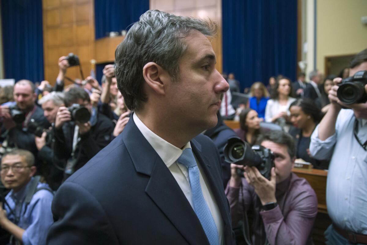 Michael Cohen is photographed by the media