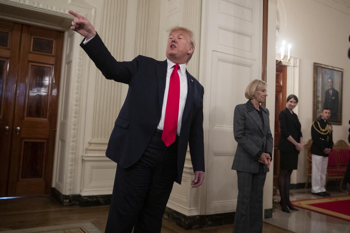 President Trump invites athletes to the Oval Office during NCAA Collegiate National Champions Day on Friday at the White House.