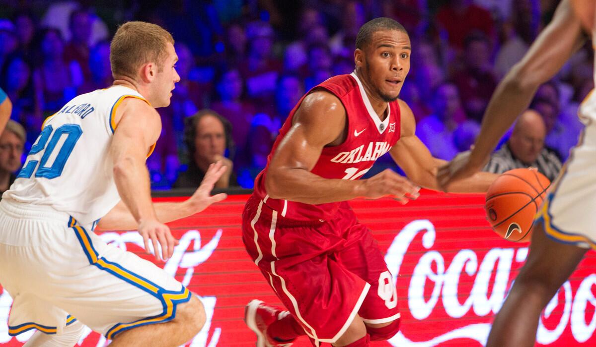 Oklahoma guard Jordan Woodard looks to drive against UCLA guard Bryce Alford during their game Wednesday in the Bahamas.