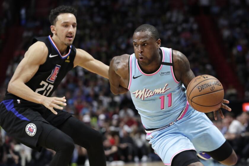 Miami Heat guard Dion Waiters (11) drives to the basket as Los Angeles Clippers guard Landry Shamet (20) defends during the second half of an NBA basketball game, Friday, Jan. 24, 2020, in Miami. (AP Photo/Lynne Sladky)