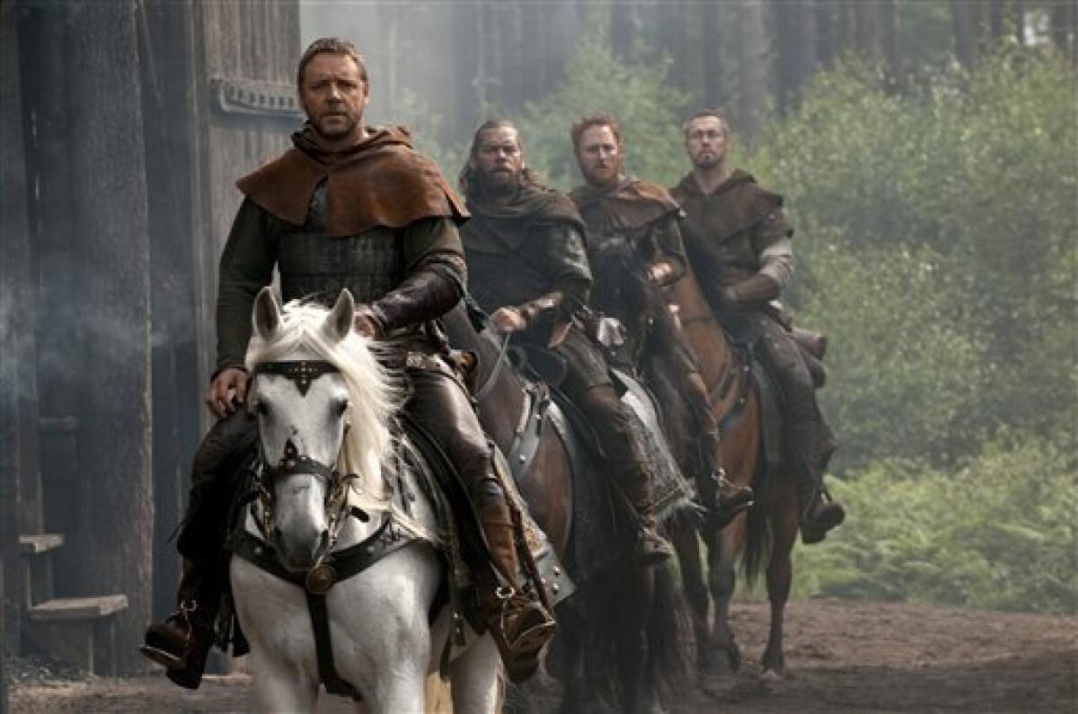 In this film publicity image released by Universal Pictures, from left, Russell Crowe , Alan Doyle, Scott Grimes and Kevin Durand are shown in a scene from "Robin Hood." (AP Photo/Universal Pictures, David Appleby)