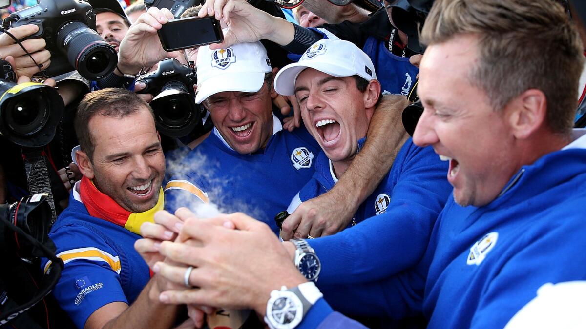 Europe's (from left to right) Sergio Garcia, Lee Westwood, Rory McIlroy and Ian Poulter celebrate the team's Ryder Cup win over the U.S. on Sunday.