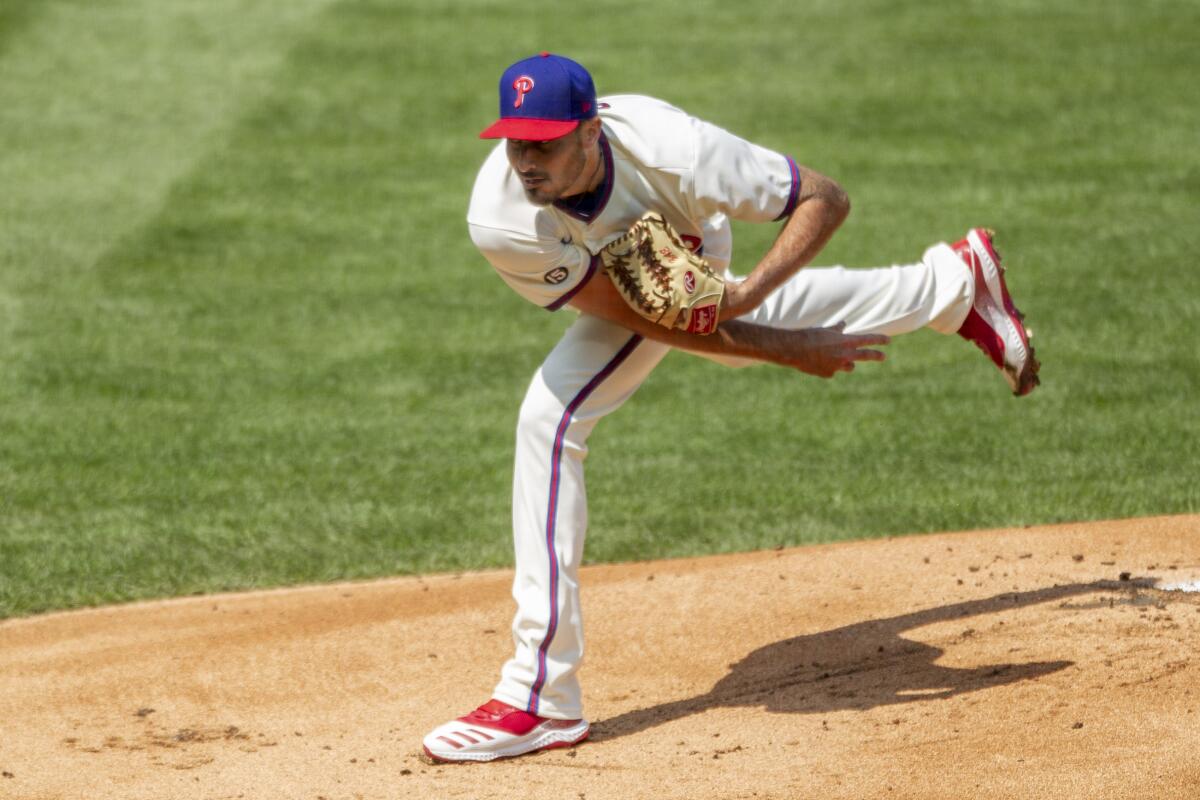 Philadelphia Phillies starting pitcher Zach Eflin throws during the first inning of a baseball game against the Atlanta Braves, Sunday, April 4, 2021, in Philadelphia. (AP Photo/Laurence Kesterson)