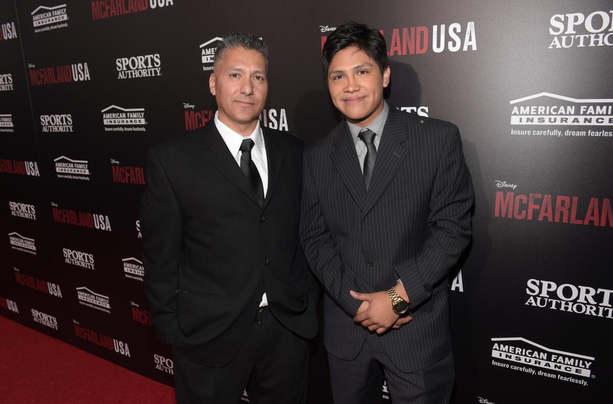 Jose Cardenas, left, and actor Johnny Ortiz attend the premiere of Disney's "McFarland, USA" at the El Capitan Theatre on Feb. 9, 2015, in Hollywood, California.