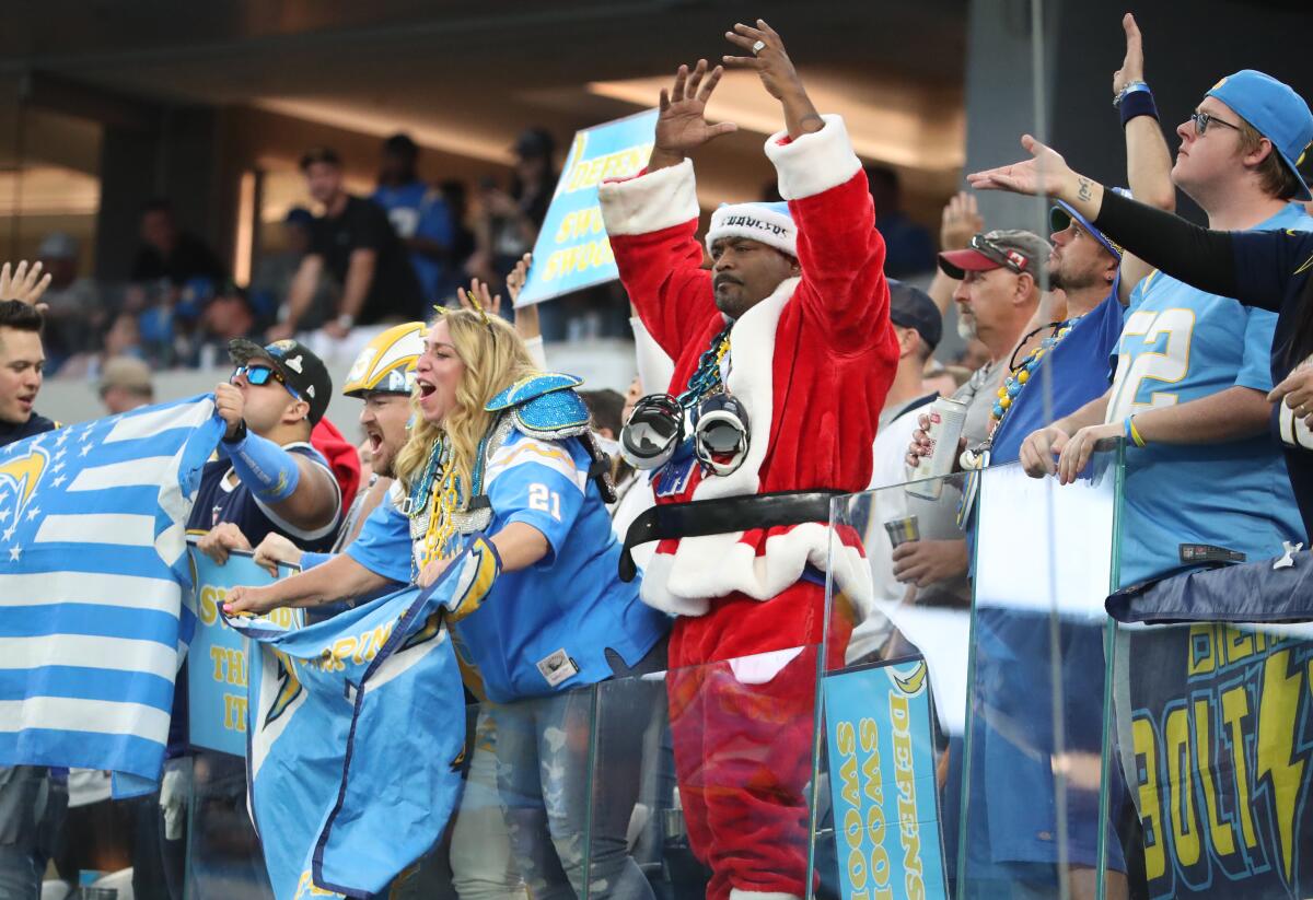 Chargers fans cheer during a win over the Tennessee Titans at SoFi Stadium on Dec. 18.