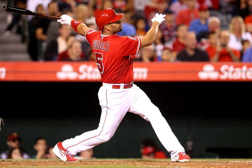 Angels' Albert Pujols hits a solo home run during a 7-3 win over the Tampa Bay Rays on Monday.