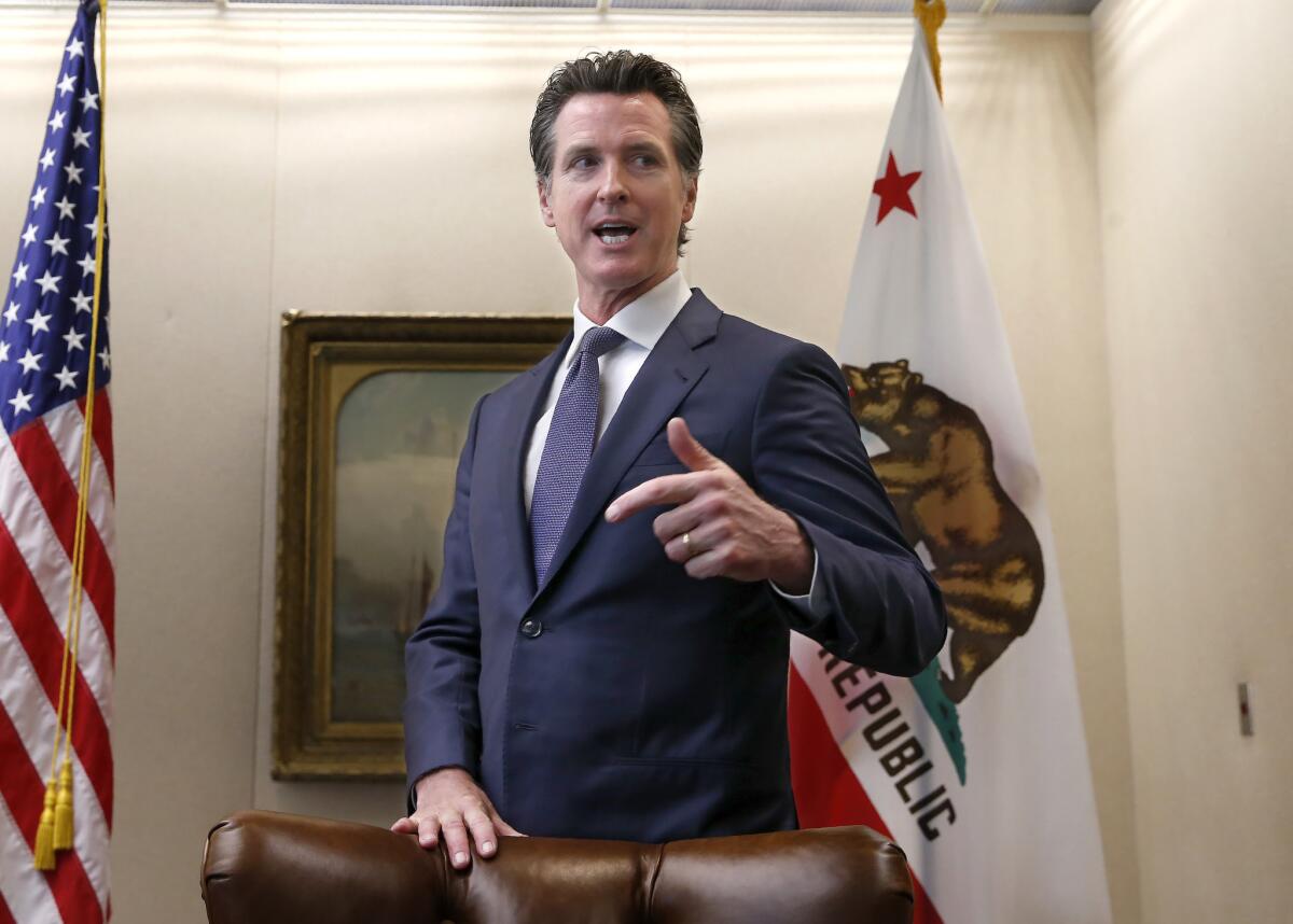 California Gov. Gavin Newsom, who recently signed a law requiring presidential candidates to disclose their tax returns, outside his Capitol office in Sacramento on July 12.